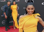Ciara shines in canary yellow  dress as she cosies up to  husband Russell Wilson at 2018 ESPY Awards