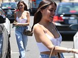 Madison Beer flaunts her midriff in crop top and goes make-up free for afternoon jaunt in LA