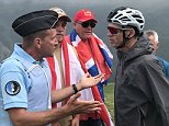 Police officer causes Chris Froome to crash after mistaking him for a fan