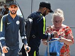 Riyad Mahrez returns to Manchester on crutches as City fear he could miss start of season