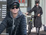 Katy Perry dons Chanel cross-body handbag and puffer jacket as she cycles around Melbourne