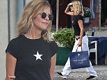 Meg Ryan opts for comfort with a casual T-shirt and slacks in Italy