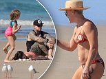 Pink rocks a bikini while enjoying family beach day in Australia after bouncing back from virus