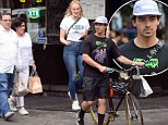 Joe Jonas and Sophie Turner do some shopping  with Joe's parents in NYC ahead of his 29th birthday