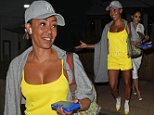 Mel B looks radiant in a vibrant yellow playsuit and matching stilettos