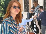 Emma Stone looks radiant as she steps onto a boat on day one of the Venice Film Festival