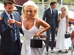 Lady Gaga holds hands with Bradley Cooper at a photocall in Venice