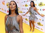 Maya Jama turns heads in a glittering silver mini dress as she dances on the red carpet of awards
