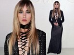 Suki Waterhouse sets pulses racing in plunging lace up black dress at Tom Ford's NYFW show