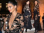 Kendall Jenner flashes her underwear in plunging dress in Paris
